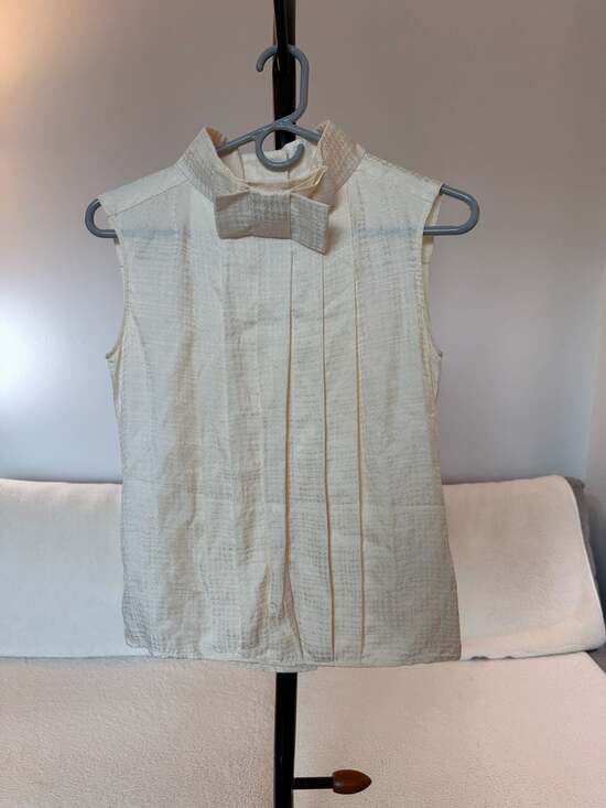 Designer Silk Pleated Sleeveless Blouse with Bow Collar and CC Globe Buttons
